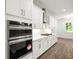 Modern kitchen featuring stainless steel double ovens and gas cooktop at 3898 Southern Valley Loop, Brooksville, FL 34601