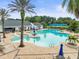 Resort-style pool with expansive deck and shaded seating areas at 3898 Southern Valley Loop, Brooksville, FL 34601