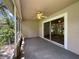 Bright screened porch with ceiling fan and sliding glass doors at 35316 Whispering Pines Dr, Zephyrhills, FL 33541