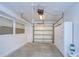 Garage with overhead door, storage cabinets and windows at 3605 Kings Rd # 102, Palm Harbor, FL 34685