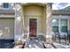 Front entry of the townhome with a double door and welcome mat at 3605 Kings Rd # 102, Palm Harbor, FL 34685