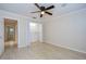Well-lit bedroom featuring hardwood floors and a spacious closet at 3605 Kings Rd # 102, Palm Harbor, FL 34685