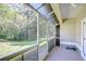 Relaxing screened porch overlooking a lush green backyard at 3605 Kings Rd # 102, Palm Harbor, FL 34685