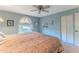 Comfortable bedroom with king-size bed and window view at 7076 Pond View Ct, Spring Hill, FL 34606