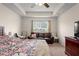 Main bedroom with sitting area and large window at 4196 Hoffman Ave, Spring Hill, FL 34606