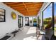 Relaxing screened porch with seating and a ceiling fan at 4359 Tahiti Dr, Hernando Beach, FL 34607