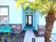 Front entry with walkway, stone accents, and teal bench at 11143 Merganser Way, New Port Richey, FL 34654