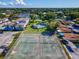 Aerial view of community tennis courts at 1127 King Arthur Ct # 305, Dunedin, FL 34698
