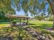 Relaxing covered pavilion with picnic tables at 1127 King Arthur Ct # 305, Dunedin, FL 34698