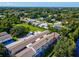 Aerial view of building and its location within the community at 1127 King Arthur Ct # 305, Dunedin, FL 34698