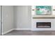 Living room with fireplace, wood mantel, and gray vinyl flooring at 1127 King Arthur Ct # 305, Dunedin, FL 34698