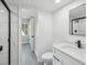 Modern bathroom with white subway tile and glass shower at 1127 King Arthur Ct # 305, Dunedin, FL 34698