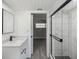 Modern bathroom with white cabinets and marble shower at 1127 King Arthur Ct # 305, Dunedin, FL 34698