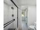Modern bathroom with white subway tile and glass shower at 1127 King Arthur Ct # 305, Dunedin, FL 34698