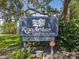 King Arthur Condominiums sign with security details at 1127 King Arthur Ct # 305, Dunedin, FL 34698
