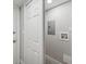 Bright laundry room with built-in cabinets and hookups at 1127 King Arthur Ct # 305, Dunedin, FL 34698
