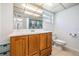 This bathroom features tile flooring, a classic vanity, and a standard toilet at 3849 Claremont Dr, New Port Richey, FL 34652