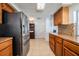 Kitchen with stainless steel appliances and wood cabinets at 3849 Claremont Dr, New Port Richey, FL 34652
