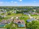 Aerial view showcasing the home, pool, and surrounding neighborhood at 3077 Ardenwood Dr, Spring Hill, FL 34609