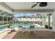 Enjoy this relaxing pool area with two lounge chairs at 3077 Ardenwood Dr, Spring Hill, FL 34609