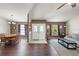 Open living and dining area with neutral colors and laminate flooring at 3077 Ardenwood Dr, Spring Hill, FL 34609