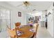 Dining area with wood table and chairs near kitchen at 3077 Ardenwood Dr, Spring Hill, FL 34609