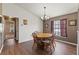 Cozy dining area with wood table and chairs, hardwood floors at 3077 Ardenwood Dr, Spring Hill, FL 34609