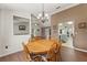 Open dining room with a view of living room and kitchen at 3077 Ardenwood Dr, Spring Hill, FL 34609