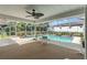 Inviting screened pool area with patio furniture at 3077 Ardenwood Dr, Spring Hill, FL 34609