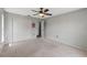 Bedroom with double doors leading to hallway at 3077 Ardenwood Dr, Spring Hill, FL 34609
