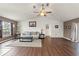Spacious living room with vaulted ceiling and laminate flooring at 3077 Ardenwood Dr, Spring Hill, FL 34609