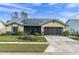 One-story house with solar panels, screened lanai, and two-car garage at 4644 Coachmen Rd, New Port Richey, FL 34655