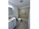 Neutral bathroom with vanity, toilet, and tiled shower/tub combo featuring accessibility features at 4931 Docner St # 4931, New Port Richey, FL 34652