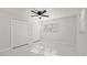 Simple bedroom with double doors and white flooring at 18101 Mason Smith Rd, Brooksville, FL 34604