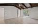 Large bedroom with wood-look floors and sliding glass doors to deck at 18101 Mason Smith Rd, Brooksville, FL 34604