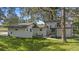 Newly remodeled home with modern exterior and a spacious yard at 18101 Mason Smith Rd, Brooksville, FL 34604