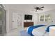 Main bedroom with ensuite bathroom and sliding glass doors to the backyard at 18101 Mason Smith Rd, Brooksville, FL 34604