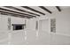 Living room with fireplace, wood beams, and white tile floors at 18101 Mason Smith Rd, Brooksville, FL 34604