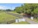 Gated entrance to a long driveway leading to the property at 18101 Mason Smith Rd, Brooksville, FL 34604
