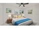 Cozy bedroom with two nightstands and blue bedding at 18101 Mason Smith Rd, Brooksville, FL 34604