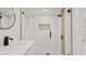 Modern bathroom with a walk-in shower and marble vanity at 18101 Mason Smith Rd, Brooksville, FL 34604