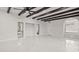 Living room with high ceilings, exposed beams, and lots of natural light at 18101 Mason Smith Rd, Brooksville, FL 34604
