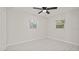Light bedroom with window and white flooring at 18101 Mason Smith Rd, Brooksville, FL 34604