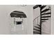 Elegant entryway with a spiral staircase and arched hallway at 18101 Mason Smith Rd, Brooksville, FL 34604