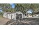 Detached garage with three garage doors at 18101 Mason Smith Rd, Brooksville, FL 34604