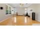 Large living room with hardwood floors and open kitchen view at 13931 Chandron Dr, Odessa, FL 33556