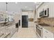 Modern kitchen with stainless steel appliances and granite countertops at 13931 Chandron Dr, Odessa, FL 33556