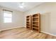 Bedroom with two bookshelves and wood flooring at 13931 Chandron Dr, Odessa, FL 33556