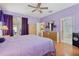 Spacious Primary bedroom with king bed and access to bathroom and backyard at 13931 Chandron Dr, Odessa, FL 33556