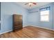 Spacious bedroom with wood floors and a large dresser at 13931 Chandron Dr, Odessa, FL 33556